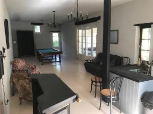 a living room with a couch and a table at Le Gite Amical des Chiens in Penne-dʼAgenais