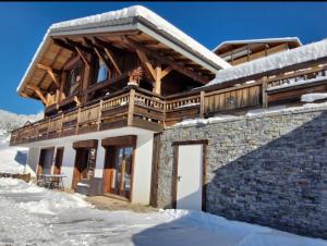 a house in the snow with a balcony at L'échappée Belle - Chatel in Châtel
