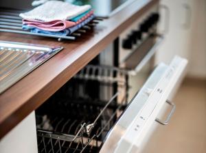 a dish drying rack with towels on a counter at Ferienwohnung Auf Dem Schönen Felde in Brilon