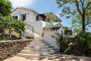 a set of stairs leading up to a house at Finca Mojito in Cómpeta
