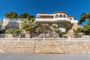 a building on top of a stone wall at Casa Romantica in Salobreña