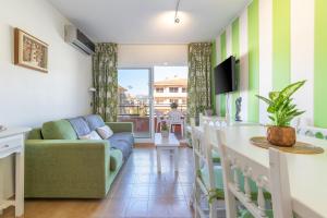 a living room with a couch and a table at Salines in L'Estartit