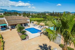 an aerial view of a house with a swimming pool at Las Naranjas in Muro