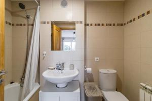 a bathroom with a sink and a toilet and a shower at Surf House Gama in Gama +24 photos
