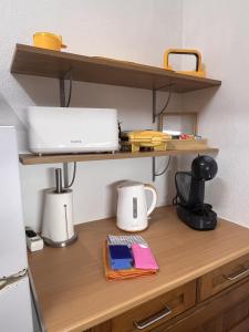 a wooden desk with a laptop on top of it at Casa Dade in Tavira
