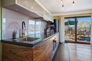 a kitchen with a sink and a counter top at Freiraum in Weiler-Simmerberg