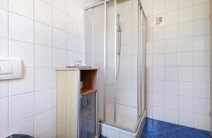 a shower with a glass door in a bathroom at Ferienwohnung Walter in Ellenbach +12 photos