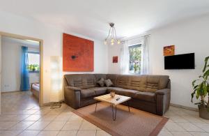 a living room with a couch and a table at Ferienwohnung Walter in Ellenbach