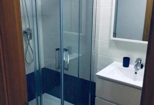 a bathroom with a glass shower and a sink at Lux Apartm Beauvivir in Torre del Mar +20 photos