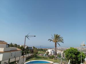 a view from the balcony of a apartment with a swimming pool at Lux Apartm Beauvivir in Torre del Mar
