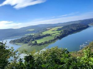 an island in a lake in the middle of a river at Yachthof Ferienwohnung, 60 m² in Scheid