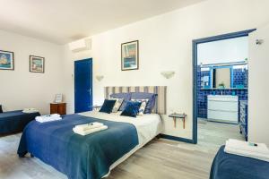 a bedroom with a large bed and a balcony at Chambre d'hote Saphir in Genouillé +26 photos