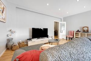 a living room with a dog laying on a couch at Casa Vista Rio in Ferragudo