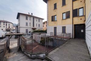 a balcony of a building with a door on it at Vigilio house in Calco