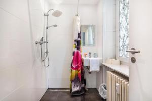 a bathroom with a shower and a sink at Aldars Urban Suite No.10 in Munich +16 photos