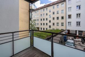 a balcony with a view of a building at Aldars Urban Suite No.10 in Munich