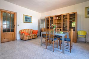 a living room with a table and chairs at Gadem House in Alghero