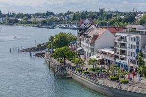 a town next to a river with a body of water at Obst- und Ferienhof Schäfler in Hattnau