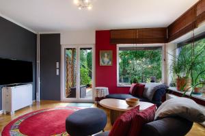 a living room with a couch and a table at Ferienwohnung Refugium Schönenberg in Sigmaringen