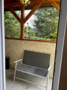 a bench sitting inside of a room with a window at Ferienwohnung Ingrid Rautenberg in Krautheim