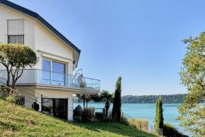 a house on the hill with a view of the water at Haus Seeblick in Sipplingen
