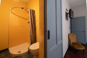 a small bathroom with a toilet and a shower at Beb La Patataia Home in Bormida +43 photos