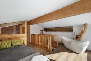 Katil atau katil-katil dalam bilik di Chalet-Suite Panorama