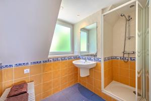 a bathroom with a sink and a shower at Évasion marine face à la mer in Plouézocʼh +26 photos