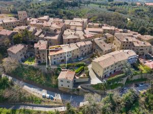 an aerial view of a village with buildings at Casina nel Borgo Antico in Bibbona
