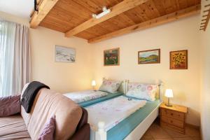a small bedroom with a bed and a window at Apartment Eulenhof 2 in Bordelum