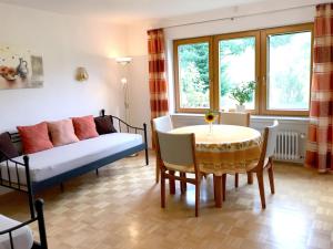 a living room with a couch and a table at Ferienhof Biegger in Tettnang +19 photos