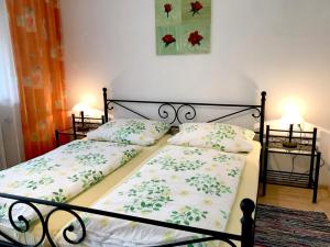 a bedroom with a bed with two pillows on it at Ferienhof Biegger in Tettnang