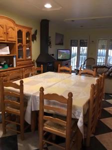 a dining room with a large table and chairs at Chalet Del Sol in Puerto Lumbreras