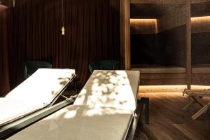 a hospital room with a bed and a window at Mysciliar Apartment Tree iii in Siusi +10 photos