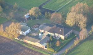 an aerial view of a large house in a field at Hof Islandpferde von der Holstenau in Eggstedt