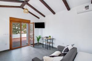 a living room with a couch and a table at Casa Celestina in Temisas