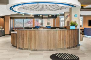 a lobby with a reception desk in a hospital at Tru By Hilton Hagerstown in Hagerstown +41 photos