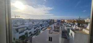 a view of a city with white buildings at Apartamento La Palma Corralejo in Corralejo