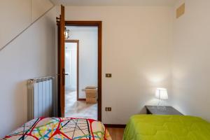a bedroom with a bed and a door to a hallway at Casa Mary in Prataccio