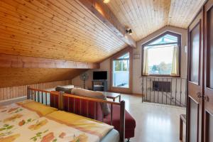 a bedroom with a bed and a large window at Haus Koch in Bad Säckingen +12 photos