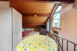 a room with a balcony with a table and a window at Haus Koch in Bad Säckingen