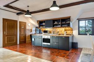 a kitchen with a sink and a stove at Ferienwohnung Eichkater in Dannau +11 photos