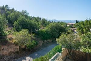 a winding river in a field with trees at Casa Lluma in Aldover