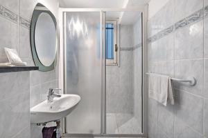 a bathroom with a shower and a sink and a mirror at Luca Via Gavazzo 18 in Bonassola +19 photos