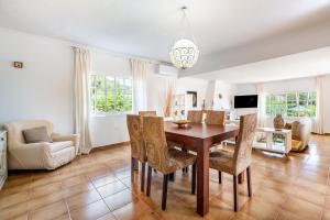 a dining room with a table and chairs at Villa Can Andreuet de Baix in Illes Balears