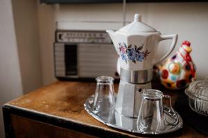 a coffee maker on a counter next to a microwave at Beb La Patataia Home in Bormida
