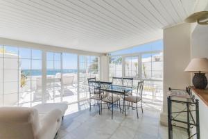 a dining room with a view of the ocean at Deluxe Apartment with Jacuzzi in Marbella