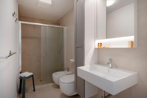 a bathroom with a sink and a toilet and a shower at Dimora Adriatica in Bari +12 photos