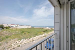 a balcony with a view of the ocean at Dimora Adriatica in Bari