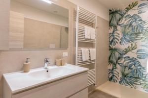 a bathroom with a sink and a mirror at Casa Balansina Lake View in Brenzone sul Garda +21 photos